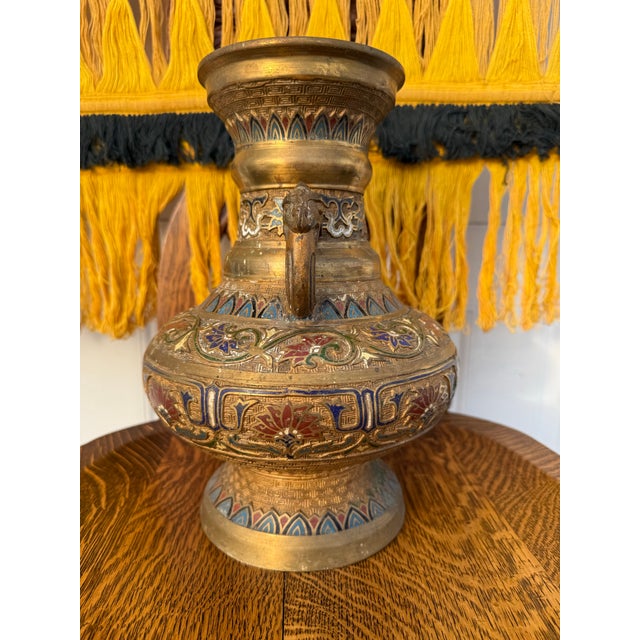 Antique Japanese Champlevé Enamel Decorated Bronze Vase with twin Sabre toothed tiger head handles above a beautifully...