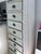 Beautiful 5-foot-tall apothecary-style cabinet with multiple storage drawers and a distressed farmhouse finish. Features...