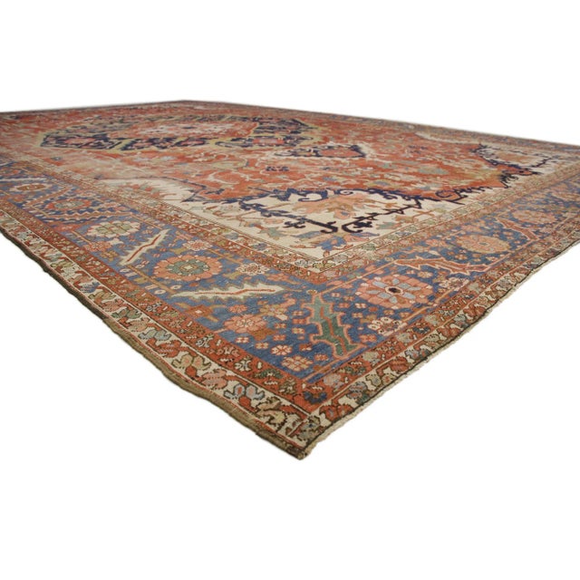 52303 Oversized Antique-Worn Persian Serapi Rug, 13'00 x 19'10. Rustic charm meets relaxed refinement in this antique-worn...
