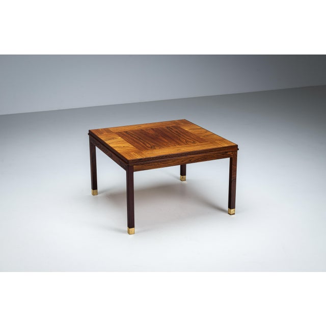This elegant square coffee table, designed and produced by HMB Möbler in Rörvik, Sweden during the 1960s, is a refined...