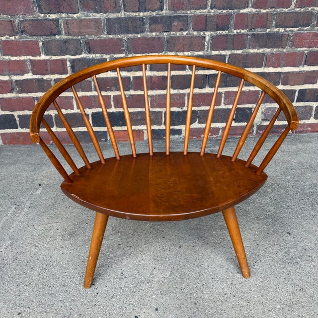 This is an Arka Spindle Chair by Yngve Ekström. Blending mid century and shaker styles, this unique wood lounge chair is a...