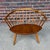 This is an Arka Spindle Chair by Yngve Ekström. Blending mid century and shaker styles, this unique wood lounge chair is a...
