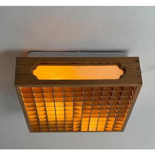 A beautifully proportioned swedish ceiling light by alda, dating to approximately the 1970s. Combining warm pine, a finely...