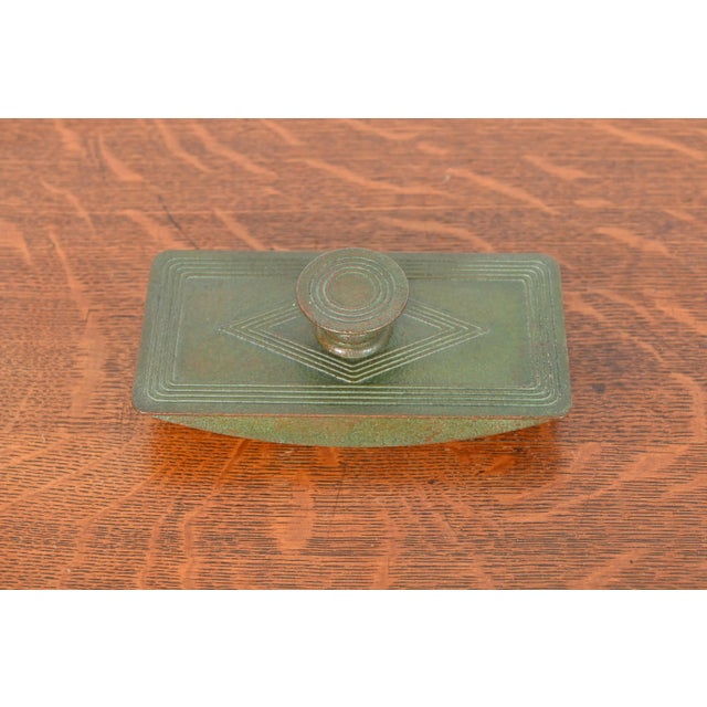 A gorgeous antique bronze rocker ink blotter featuring the iconic Graduate pattern in verdigris green patina By Tiffany...