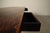 A substantial dining table designed by jean batenburg for mi, belgium, circa 1969. executed in dark-stained oak, the table...