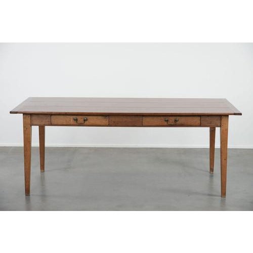 We are offering this beautiful, luxurious, and charming old French dining table made of cherry wood with two drawers. This...