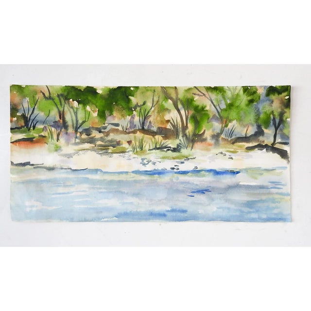Small watercolor on paper of riverside landscape. Unsigned. Unframed, minor crinkling to paper.