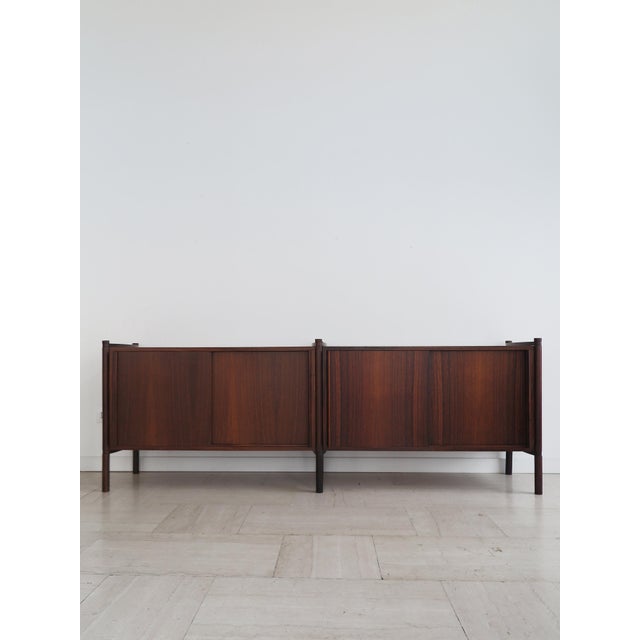 Italian sideboard, model "Archimede," designed by Fukuoh Hirozi and produced by Gavina, made of dark wood with a system of...