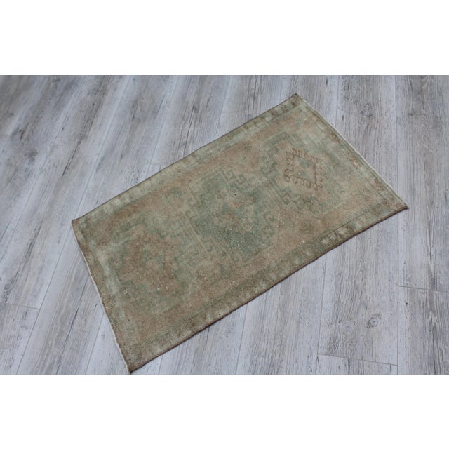 This beautiful, traditional vintage, handwoven Turkish rug is approximately 60 years old. It is handmade of very fine...
