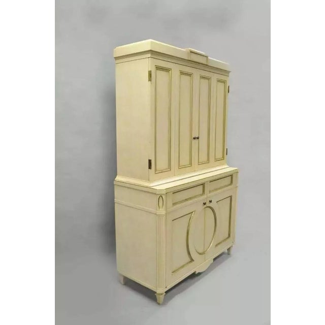 French Neoclassical Louis XVI Style Cream & Gold Painted Bar Cabinet by Decca (A). Item features a heavy two part...