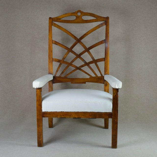 Rare Art Nouveau armchair in big size and intricate back. Reupholstered in seat and armrests and fabric in domestic. Buyer...