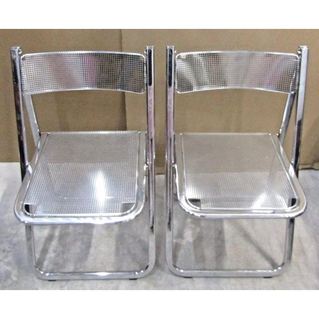 Matched Pair of Perforated Chrome Tamara Folding Chairs from Arrben, Italy 1970s They fold for easy storage and look great...