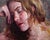 This oil painting depicts a serene figure resting her head on her hand, conveying a deep sense of introspection and...