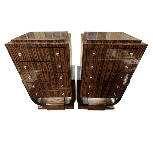 A tall pair of sleek, sexy, Art Deco chests, wrapped with an exotic wood veneer, glossy lacquered finish, and polished...
