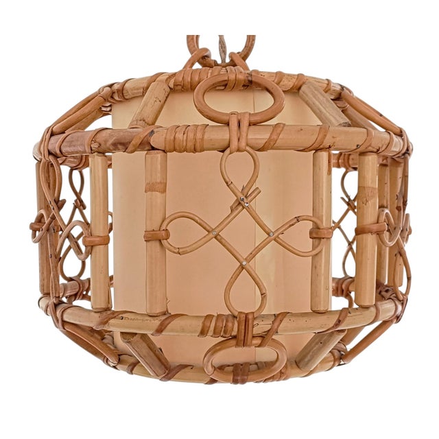 Mid-Century French Riviera Bamboo and Rattan Pendant Lamp, circa 1960s A charming and beautifully crafted pendant lamp...