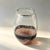 This hand-blown glass vase is formed by merging a translucent clear layer, a dark ribbon and a reddish-brown background in...