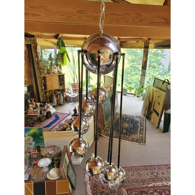 A very fine and rare vintage original Robert Sonneman style helmet drop rod cascading chandelier. High quality...