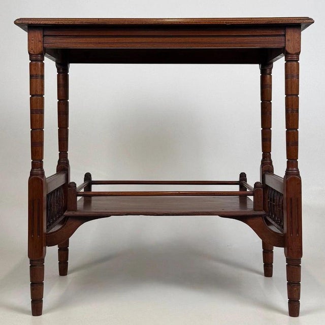 A beautifully crafted early 20th-century English Edwardian side table, finely constructed in mahogany and combining...