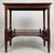 A beautifully crafted early 20th-century English Edwardian side table, finely constructed in mahogany and combining...