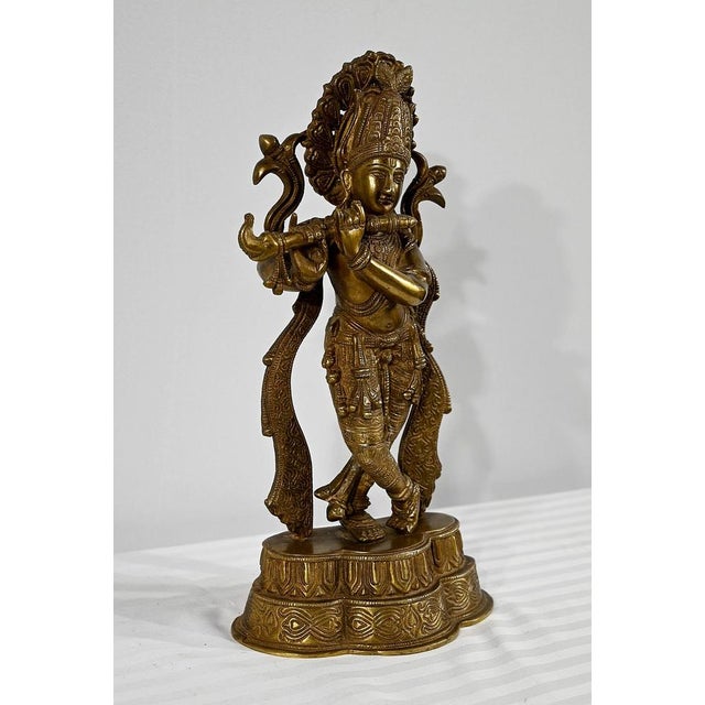 Bronze subject, with golden patina, representing Krishna. Divinity of compassion, tenderness and love, Krishna is the...