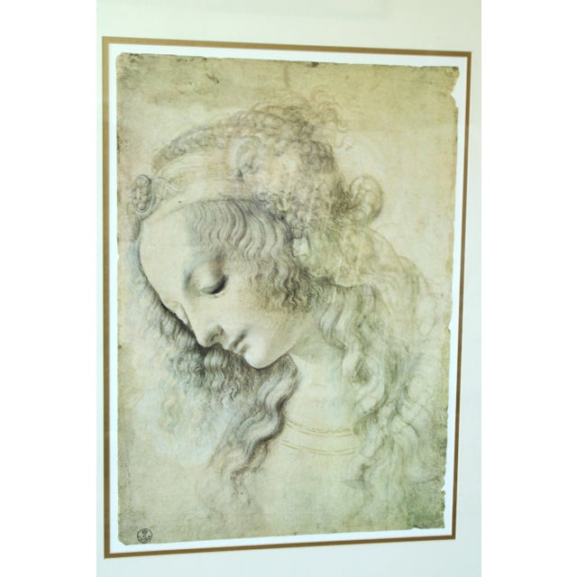 Late 20th Century Leonardo da Vinci-Head of Leda portrait print. Presented under art glass with custom matting and stylish...