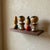 Vintage Japanese miniature kokeshi doll set of four, circa 1960s–1970s. Made in Japan from turned wood with individually...