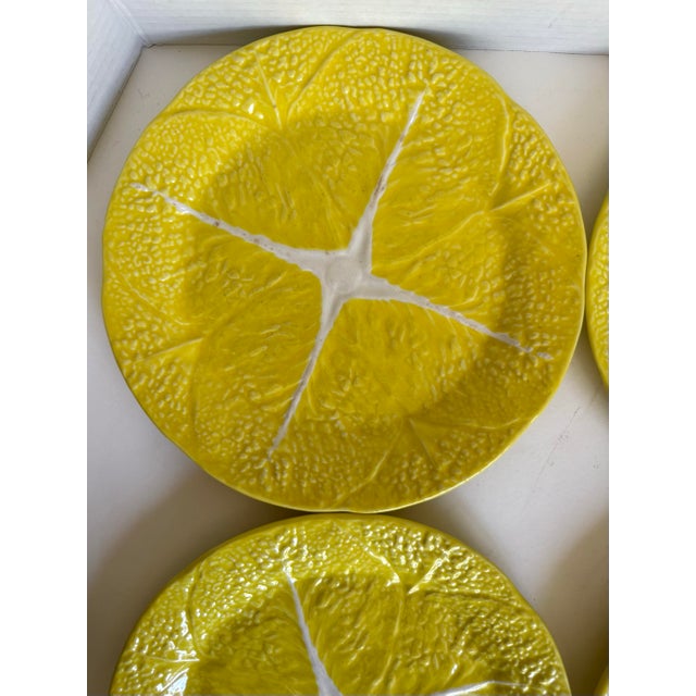 Here is a vintage (circa 1950-1960s) set of four Portuguese majolica cabbage leaf dinner plates by SECLA, featuring a...