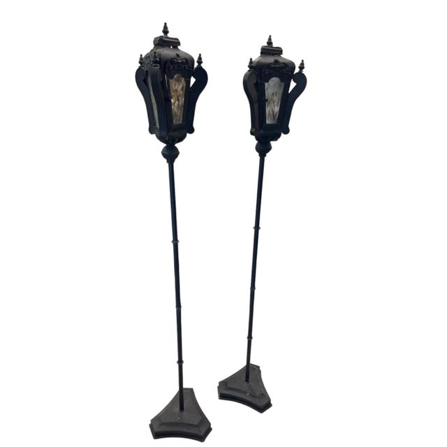 This striking pair of vintage floor-standing lanterns brings classic Venetian or street-lamp elegance into any interior or...
