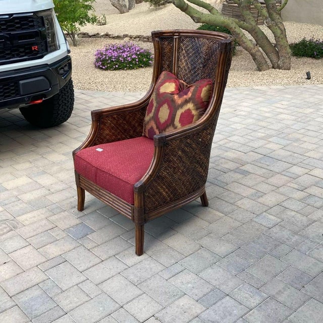 This Lexington Furniture lounge chair has a sturdy wicker frame and a comfortable high back. It comes with a red seat...