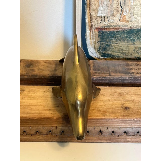 Vintage brass MCM dolphin figurines. Possibly from the 70s. Nice Patina and character. Vintage Condition as pictured....
