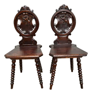 18th Century Italian Chestnut Hall Chairs Carved With Lion Crests - A Pair