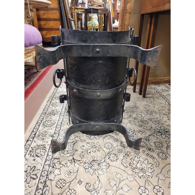 Antique arts & crafts hammered iron log holder. Features 3 and 3 scroll side supports, iron base, iron ring carrier, all...