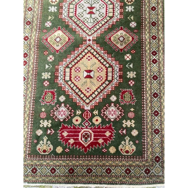 Beautiful vintage runner with nice chirwan design and beautiful colors with green field, yellow, purple and pink, entirely...