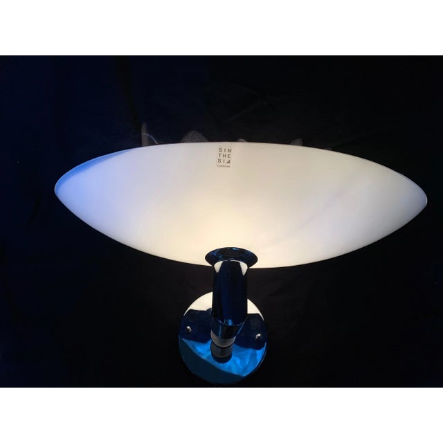 Fantastic pair of glass wall sconces is from a company in Murano opaline white, nickel-plated iron structure. Objects in...