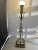 This MCM stunning vintage table lamp is a true piece of art, with a clear glass stacked design and a gilt metal base that...