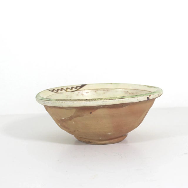 This is a beautiful, rustic, primitive clay bowl with a fish in the style of antique Byzantine ceramics with a half glazed...