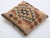 A one-of-a-kind handwoven Afghan wool kilim accent pillow featuring horizontal diamond medallion. Cut and sewn by hand...