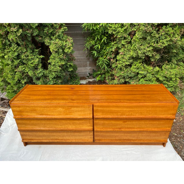 A classic example of Danish Mid-Century Modern design, this low-profile six-drawer dresser features the clean lines and...