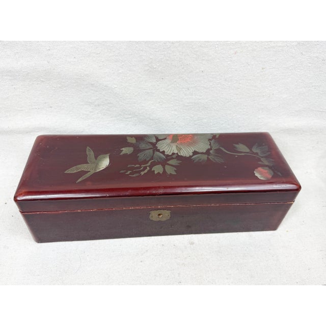 Vintage chinoiserie box. Lacquered with a bird and floral design. Perfect to use as a decorative accent, storage or a...