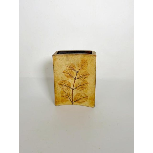 Handcrafted French pottery vase dating from the 1960s. Featuring a clean rectangular silhouette with subtly curved sides,...