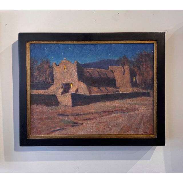 Moonlight San Lorenzo de Picuris captures a serene night scene, where the adobe structure of the church stands illuminated...
