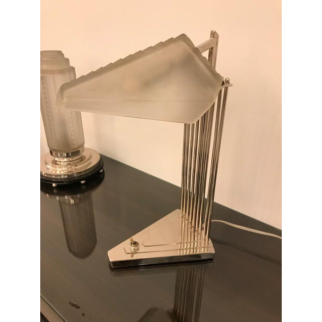 French Art Deco desk or table lamp signed by Genet et Michon. Having geometric shade in frosted glass with polished...
