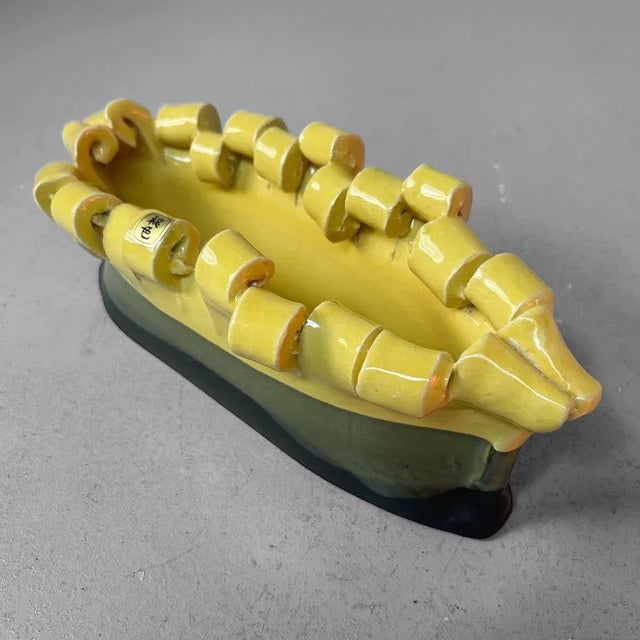 A striking mid-century ikebana piece with an elongated, organic form. Dimensions: height 12 cm, width 32 cm, depth 13 cm...