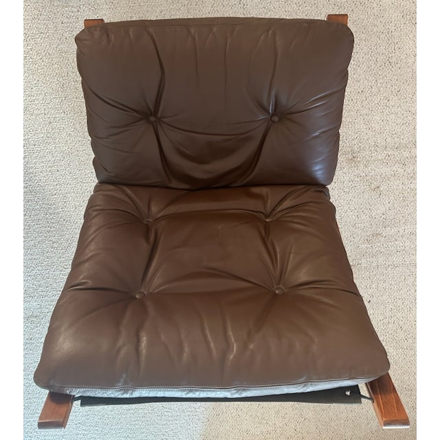 Large Norwegian Siesta armchair; brown leather chair with Beech wood frame.