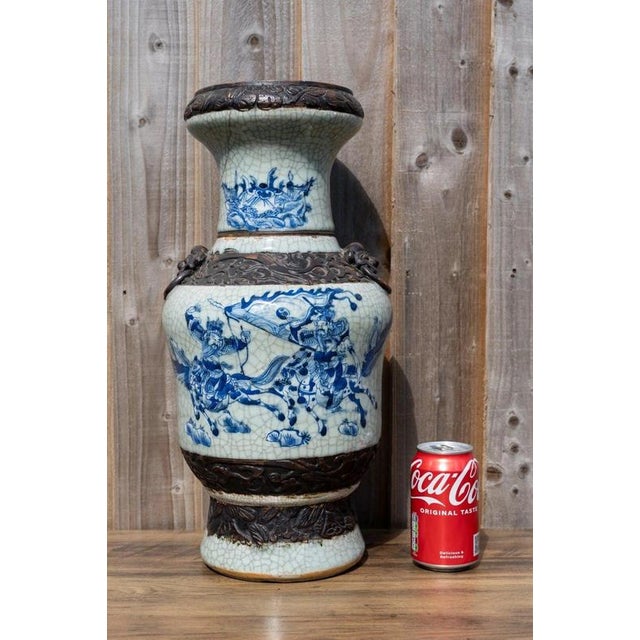 An impressive large Chinese porcelain vase dating to the Qing dynasty, circa early 19th century, distinguished by its...