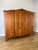 An elegant Vintage French Louis wardrobe in Oak , featuring four beautifully shaped panelled doors, a sweeping curved top...