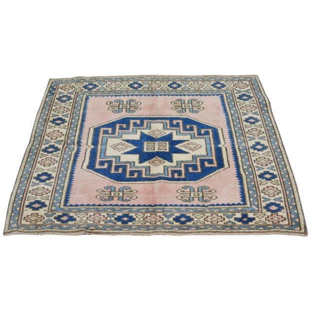 Hand-knotted with care using traditional rug-making techniques, this wool rug blends timeless craftsmanship with a modern...