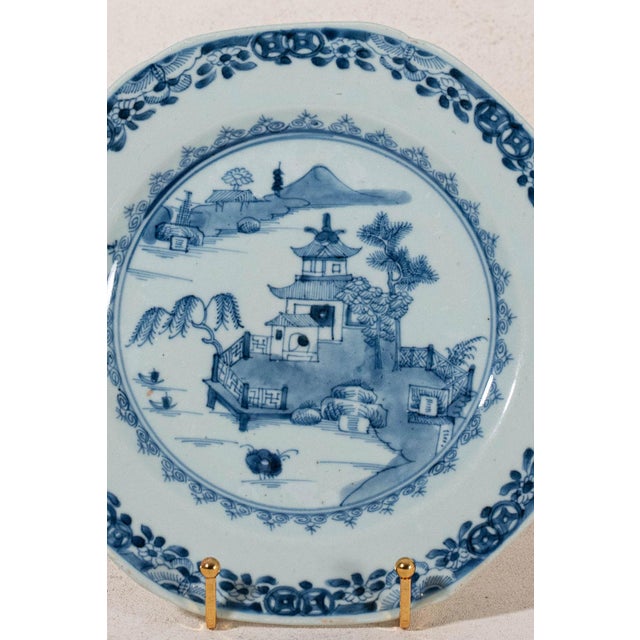 18th-century Chinese export porcelain plate featuring a hand-painted blue and white design with a shaped rim.