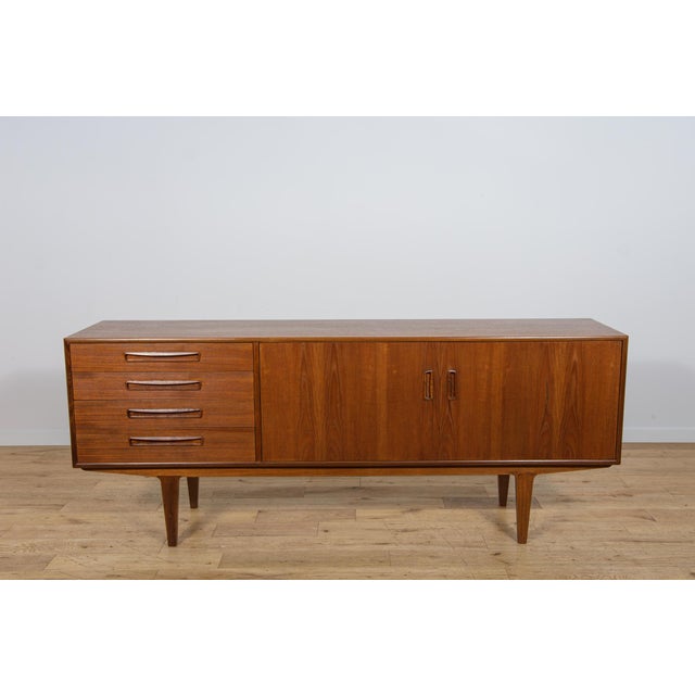 This sideboard, manufactured by the British furniture maker G-Plan in the 1960s, is an excellent example of timeless Mid-...