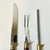 This vintage Cutlery Set is from the 1950s. It features a Carving Knife, Fork and Sharpener. The blades are stainless...